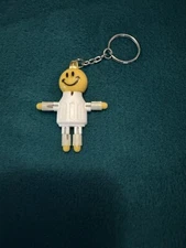 SMOKEBUDDY Keychain White Plastic Smoke Buddy Poseable Happy Smiley Face