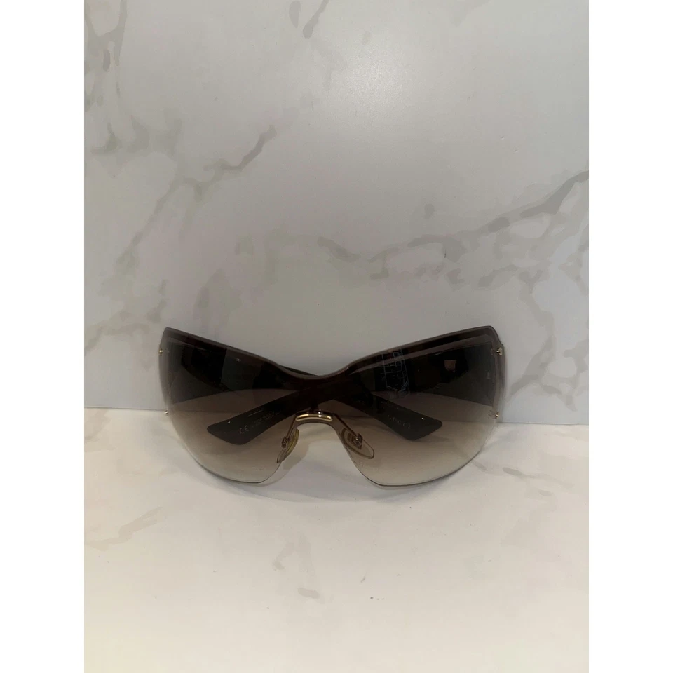 Gafas de sol Gucci GG 1825/S para mujer brazos anchos lentes degradadas marrón sin montura protector