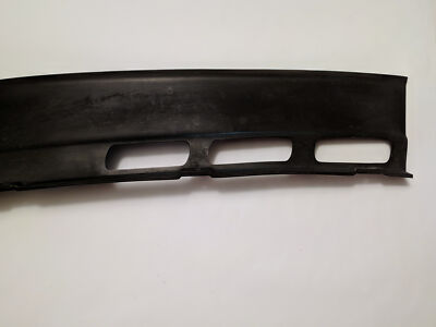 Genuine BMW E28 Bumper side plastic extension. Passenger. Front  