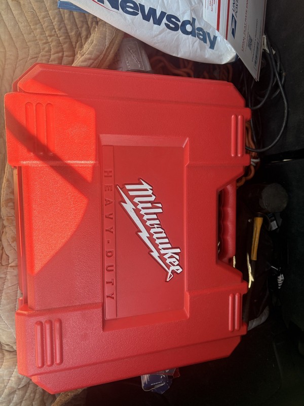 used milwaukee tools, hammer drill, and sawzall