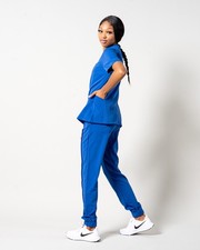 woman blue jogger scrub set elastic drawstring waist 5 pocket top 4 pocket pant
