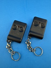 Very Nice Pair Hornet 2-button Keyless Remote Transmitter Fob Ezsdei467 - Tested Very Nice Pair Hornet 2-button Keyless Remote Transmitter Fob Ezsdei467 - Tested