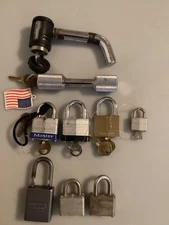 LOT OF NINE LOCKS SIX MASTERLOCK, ONE AMERICAN LOCK, TWO UNMARKED, SIX HAVE KEY