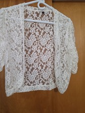 Cream Colored lace bolero jacket with sleeves used No snags.
