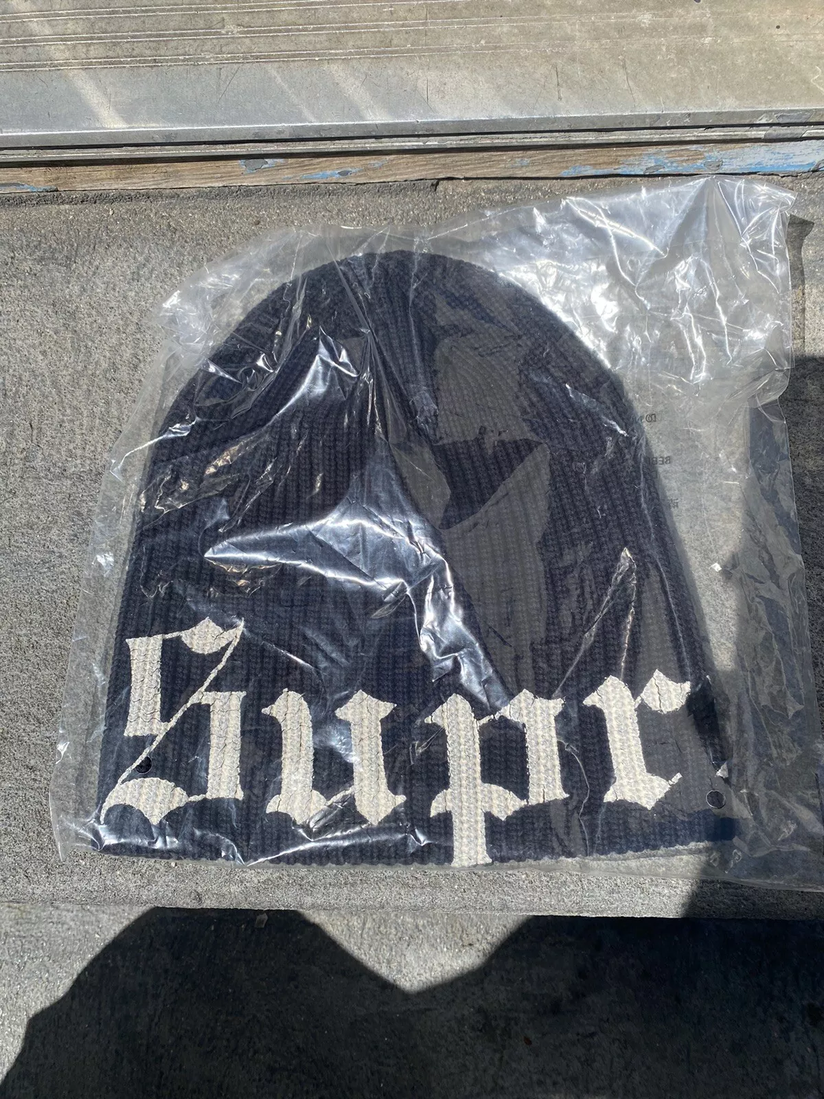 Bonnet noir imprimé ancien anglais Supreme