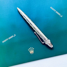 A Rolex-branded palladium-finish pen in a VIP gift box — a slice of luxury brand collectible culture that desktop collectors and watch enthusiasts will obsess over.