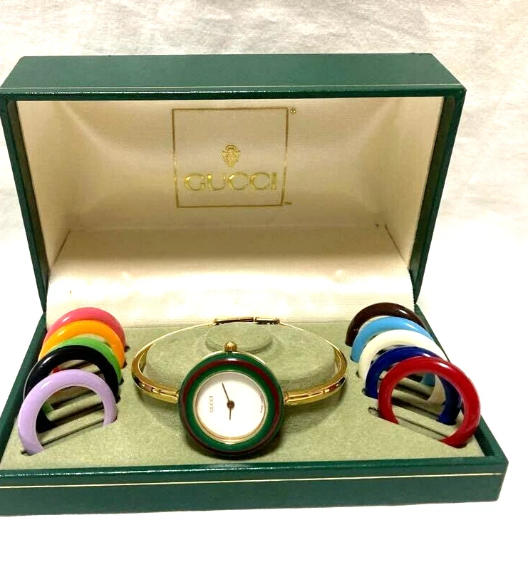 Montre Gucci à lunette à changement 11/12 cadran blanc bracelet quartz pour femme