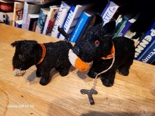 TWO VINTAGE 1950s FURRY FELT WIND UP  DOGS W/ SOCKS made in  JAPAN