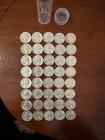 circulated one full roll of 1964Washington 90% silver quarters