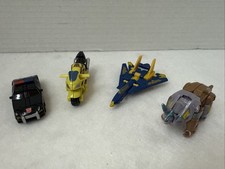 2000’s Mini Transformers Lot of 4 Vintage Dinosaur, Jet, Car, And Motorcycle