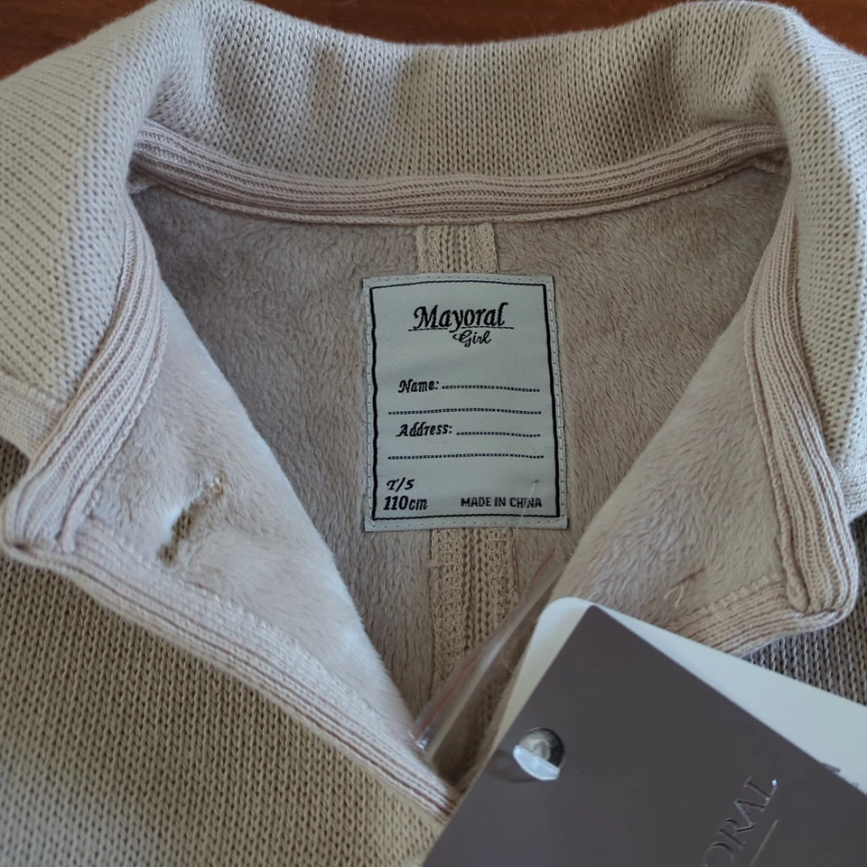 Abrigo Mayoral Chic Niñas Tejido Guisante Beige Talla 5. Bolsillos con botones de punto forrados de vellón Foto 3 de 4