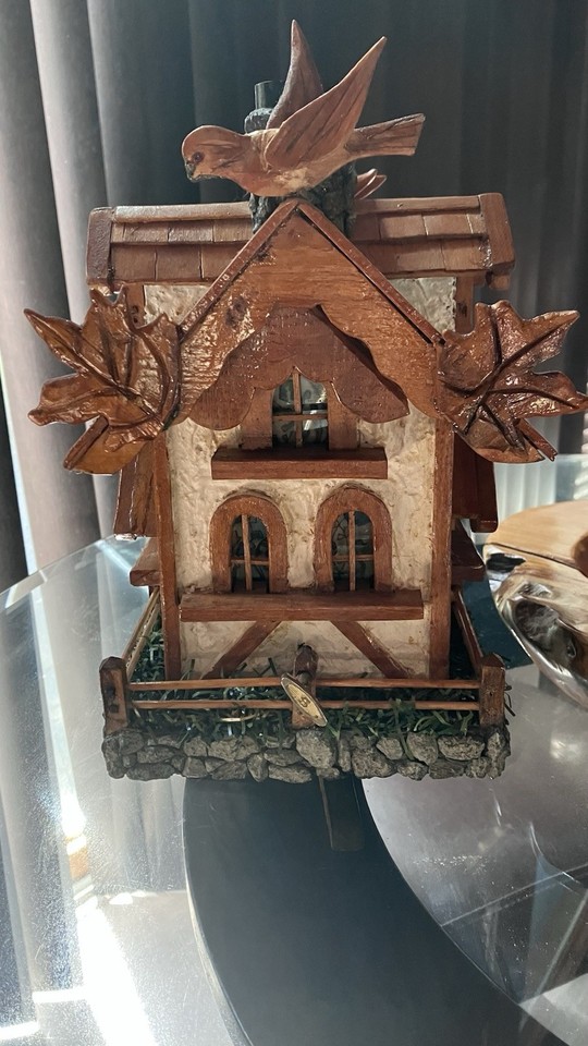 A large Swiss chalet music box you can literally peek through the windows of — the architectural detail and scale make it more diorama than trinket.