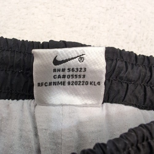 Pantaloni a vento Nike vintage anni 90 foderati pantaloni pista zip alla caviglia neri UOMO M 30x30 - Foto 4 di 11