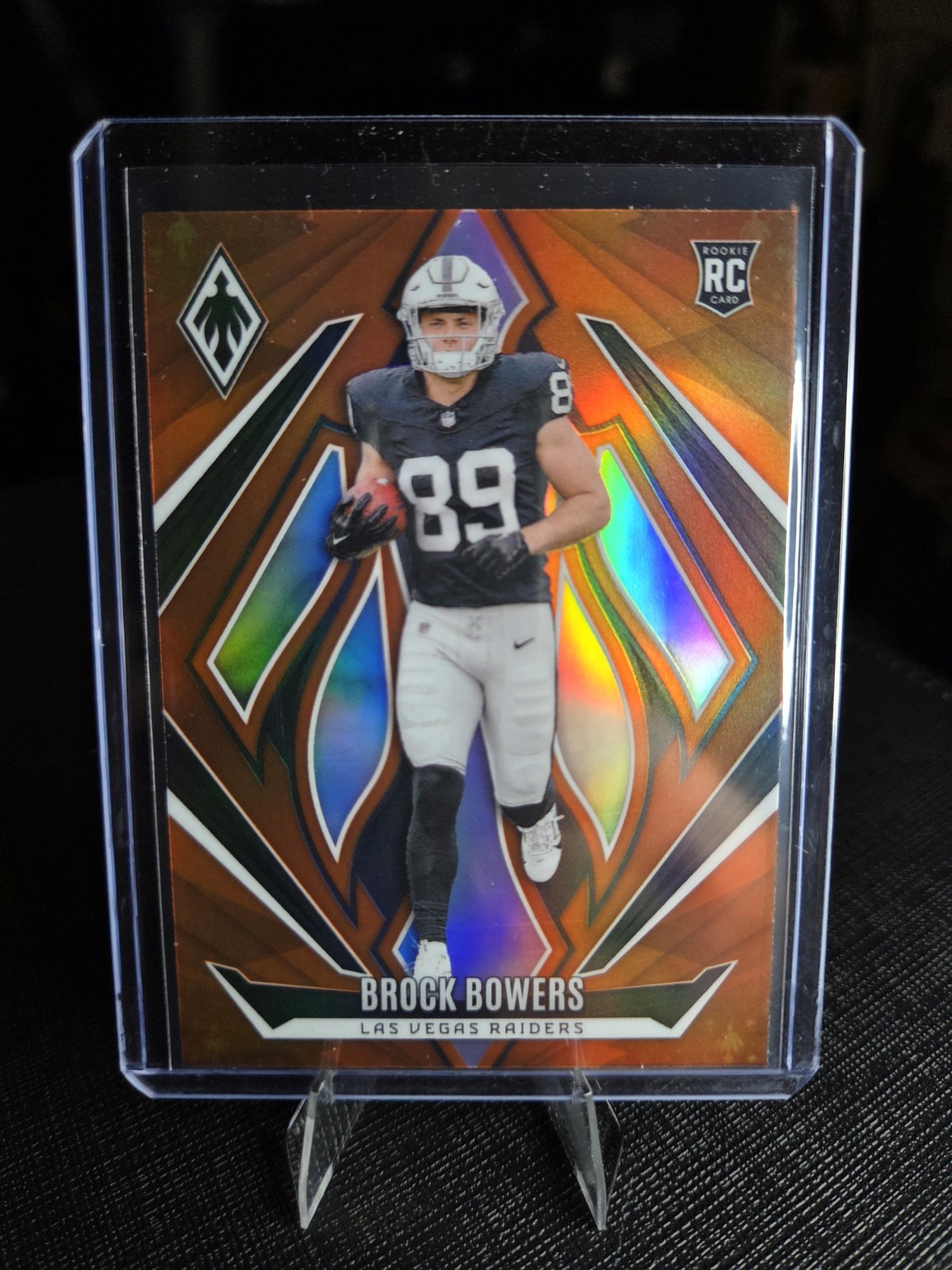 2024 Panini Phoenix - Rookies Brock Bowers #165 Orange Fade (RC)
