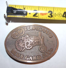VINTAGE BELT BUCKLE FARMLAND SERIES JOHN DEERE A COOP LIBRICANTS BLUE GARD 500