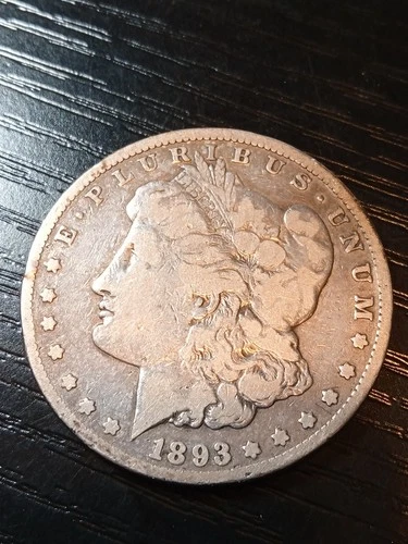 1893-CC silver Morgan dollar. Fine. Small ding. Nice. No reserve.