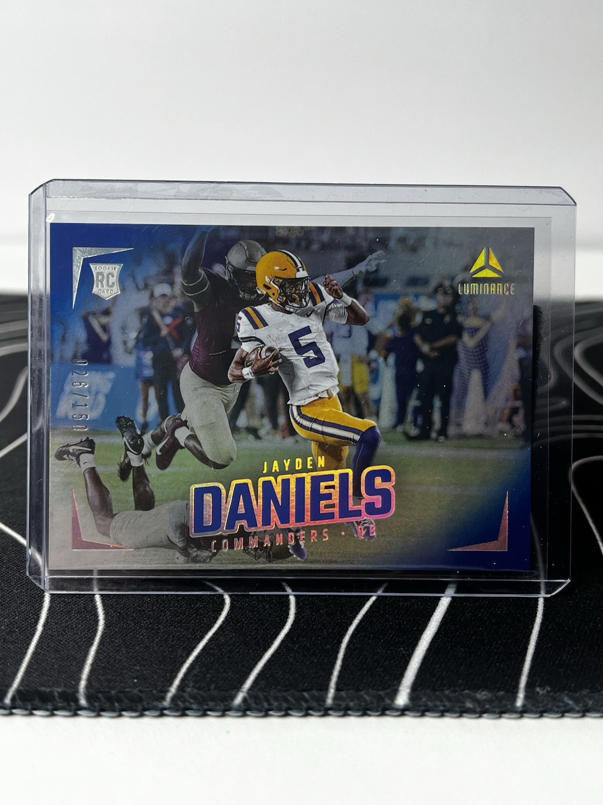 2024 Panini Luminance Rookies Jayden Daniels #182 Blue /150 (RC)