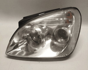 921011D020 Projektor Links KIA CARENS 2a Serie 2.0 16V CRDi VGT Mnv 5p/d/1991cc