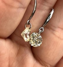 Sterling silver dangle earrings with round cut cubic zirconia