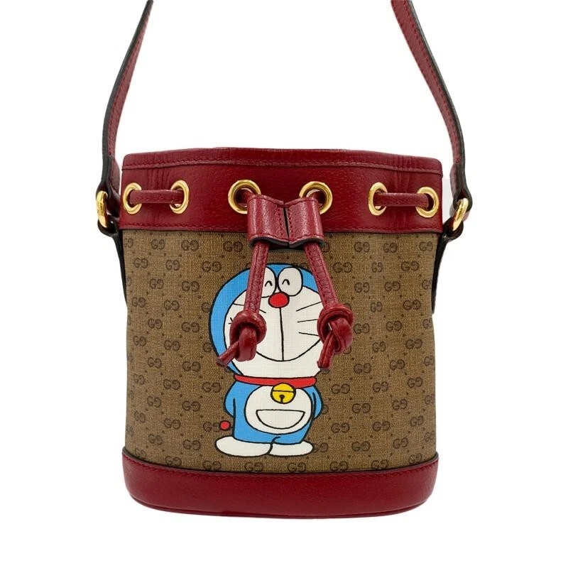 Mini sac seau à bandoulière GUCCI X Doraemon Collaboration GG Supreme 647801 2410 ans