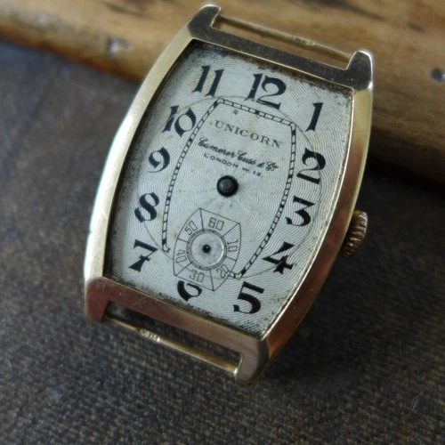 VINTAGE GENTS 1920s ROLEX UNICORN "CAMERER CUSS " TANK TONNEAU SHAPE IN 9K GOLD