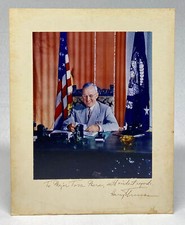 Color photograph of President Harry Truman signed and inscribed on the mount