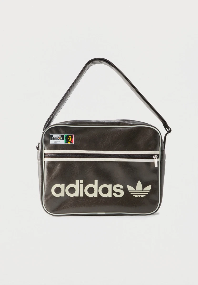 Preços baixos em Bolsas de mensageiro de poliuretano Adidas