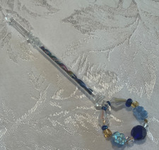 Beautiful vintage glass lace bobbin with pretty spangle