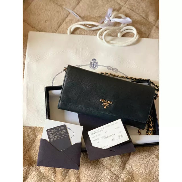 Prada hotsell wallet used