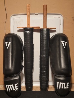 Title MMA Lg. Vinyl Shin Instep Guards & 26''L Foam Wood Handled Sparring Swords