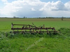 Photo 6x4 Monxton - Tilling Machine A tilling machine that has been left  c2010