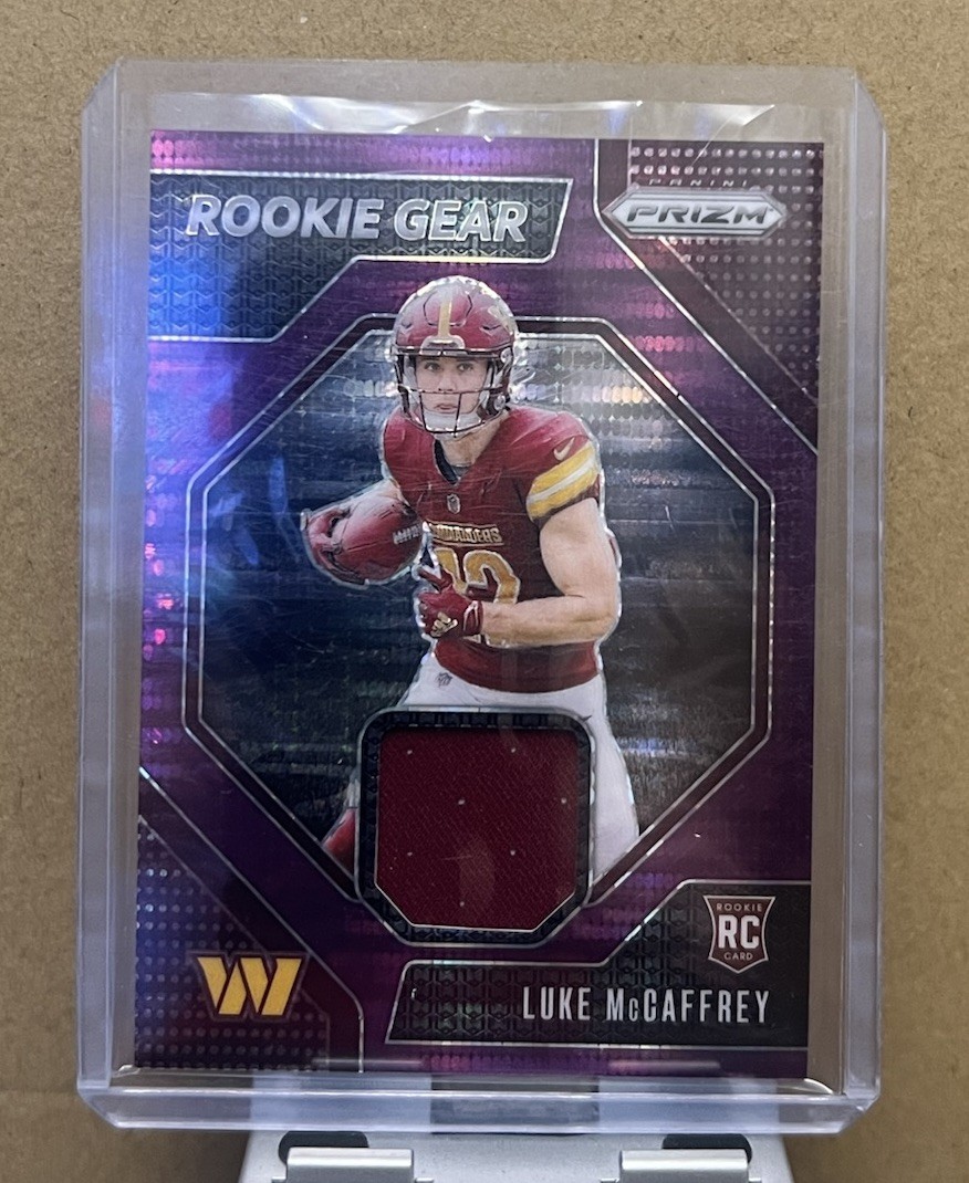 2024 Panini Prizm Rookie Gear Luke McCaffrey #RG-LMY Purple Pulsar Prizm MEM, RC