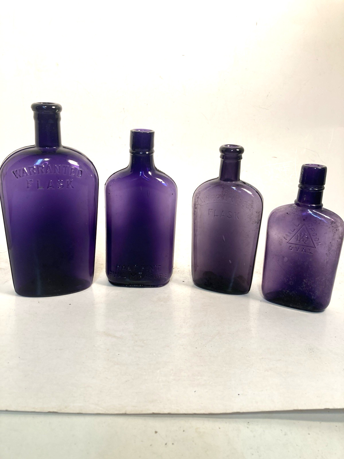Vintage Purple Glass Whiskey Bottles, EMBOSSED, 3 NOT DUG bo