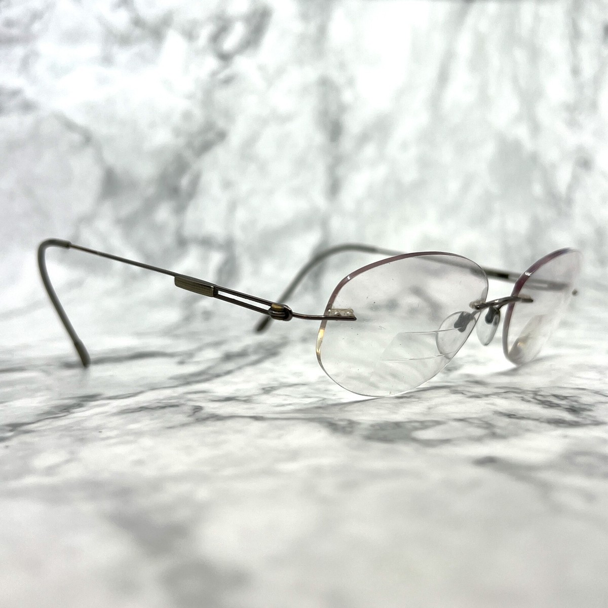 Silhouette Rimless Oval Sunglasses in Black Lenses with Purple Temples titan7534 Silhouette Eyeglasses 7534 10 6081 Titan Blue Rimless Frame  main image 4