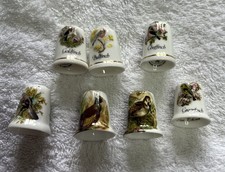 7 Vintage Thimbles Depicting Various Birds