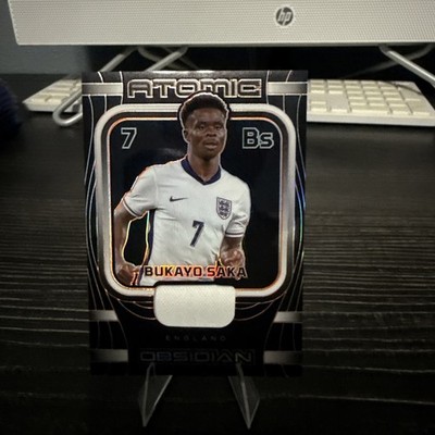 BUKAYO SAKA 2023 OBSIDIAN ORANGE ETCH ATOMIC PATCH ENGLAND /99 Q2723