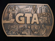 TD15116 VINTAGE 1970s  GTA  UNKNOWN COMPANY ADVERTISEMENT BELT BUCKLE