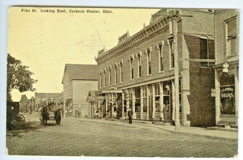 Jackson Center OH Zenner Drugs,Meat Market & Bakery on Pike St. Looking East1910