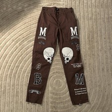 Brown and white boohoo jeans with skulls and motorcycle patches Size 28R