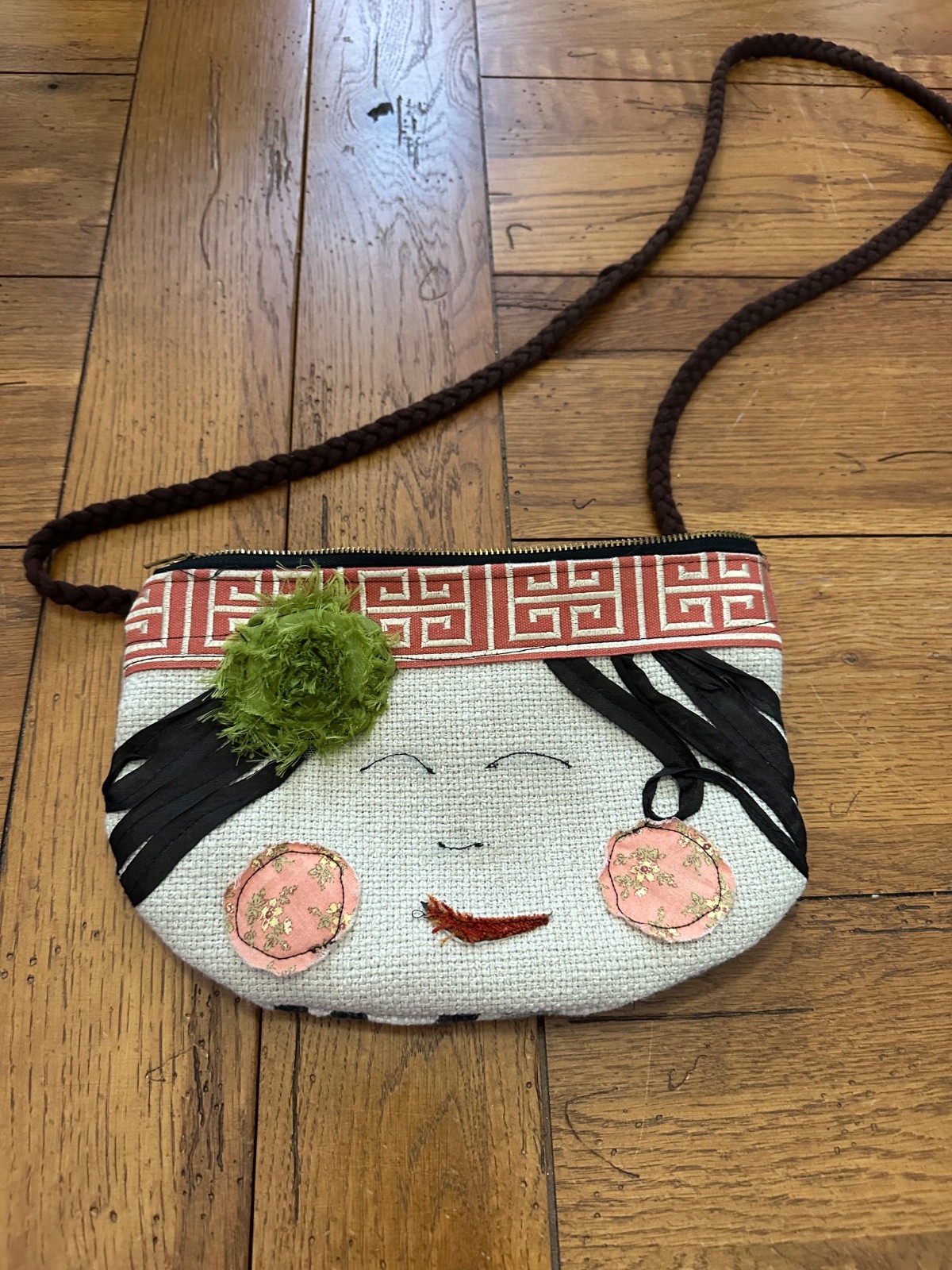 small patchwork purse with face embellishments - image 1