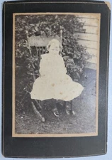1900's Photograph Little Girl sitting On Chair Outside