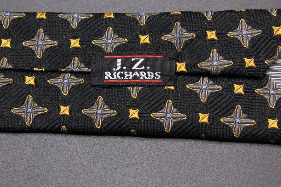 Corbata de seda JZ RICHARDS. Floral estrella negra con azul y amarilla. Foto 4 de 4