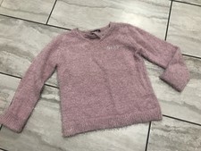 Girl  s size large pink fuzzy DKNY logo vneck sweater..