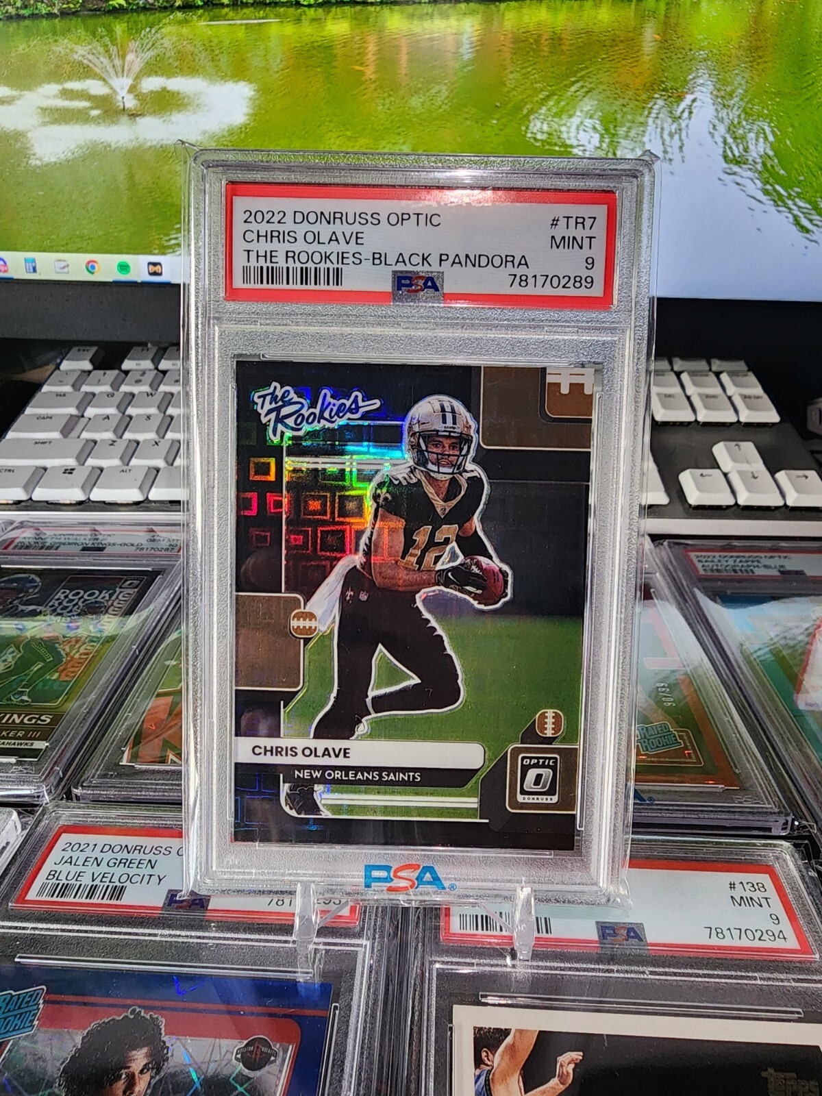 2022 Donruss Optic Chris Olave RC The Rookies Black Pandora 02/25 PSA 9 Saints