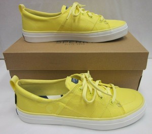 yellow sperry sneakers