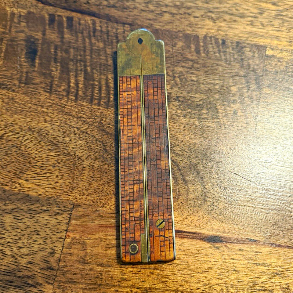 A handcrafted wood and brass pocket level with bubble vial — the kind of artisan tool object that looks as good on a desk as it does in a toolbox.