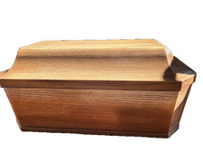 The Pet Casket deluxe lined, Medium Oak finish, in original box.