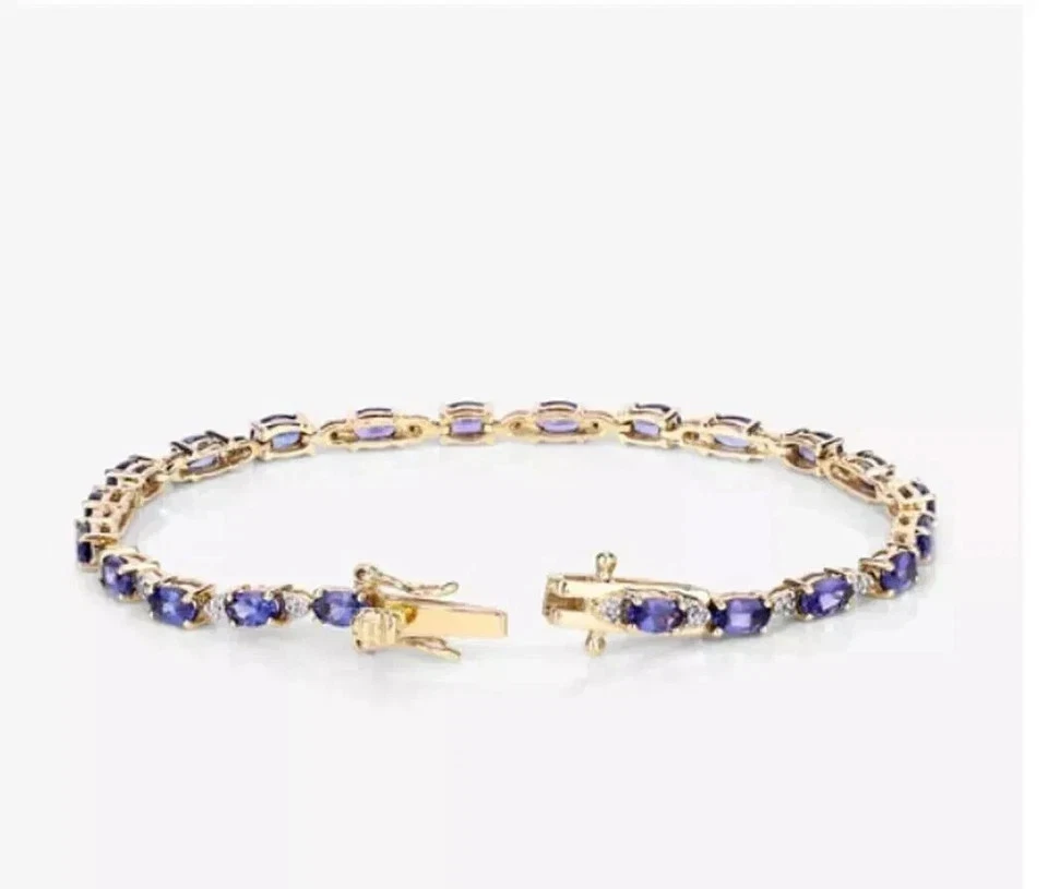 Brazalete de tenis de tanzanita azul de corte ovalado de 7 quilates enchapado en oro amarillo de 14 quilates Foto 3 de 4