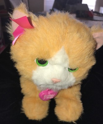 stuffed cat that meows and purrs