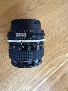 Nikon AI 24mm wide angle lens with originwith original caps.